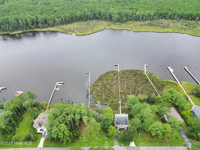 Waterfront homesite with extensive dock frontage in the gated on Harbour Point Golf Club in North Carolina - for sale on GolfHomes.com, golf home, golf lot