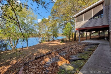 This charming waterfront home on Carolina Lake is the perfect on Carolina Lakes Country Club in North Carolina - for sale on GolfHomes.com, golf home, golf lot