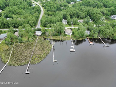 Waterfront homesite with extensive dock frontage in the gated on Harbour Point Golf Club in North Carolina - for sale on GolfHomes.com, golf home, golf lot