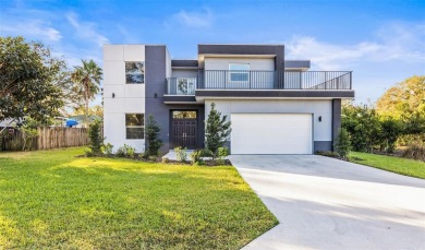 Welcome to this stunning 5-bedroom, 5.5-bathroom CONTEMPORARY on Temple Terrace Golf and Country Club in Florida - for sale on GolfHomes.com, golf home, golf lot