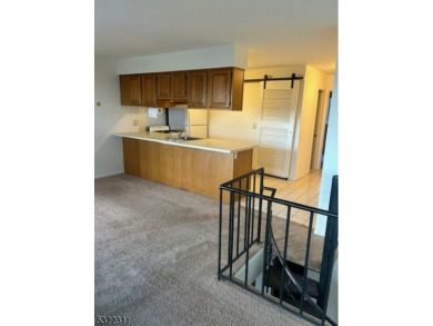 IMMACULATE TWO-BEDROOM MULTILEVEL CONDO. FRESHLY PAINTED, NEWER on Minerals Golf Club in New Jersey - for sale on GolfHomes.com, golf home, golf lot