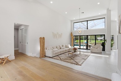 Exquisitely renovated 4BR/4BA lakefront estate in the desirable on  in Florida - for sale on GolfHomes.com, golf home, golf lot