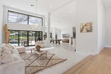 Exquisitely renovated 4BR/4BA lakefront estate in the desirable on  in Florida - for sale on GolfHomes.com, golf home, golf lot