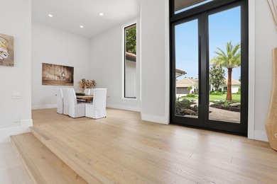 Exquisitely renovated 4BR/4BA lakefront estate in the desirable on  in Florida - for sale on GolfHomes.com, golf home, golf lot