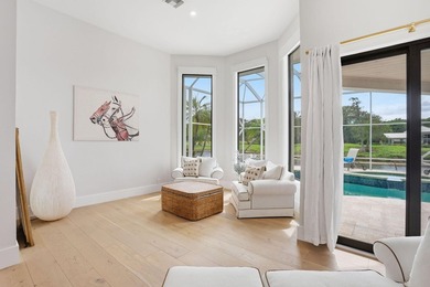 Exquisitely renovated 4BR/4BA lakefront estate in the desirable on  in Florida - for sale on GolfHomes.com, golf home, golf lot