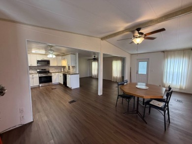 THIS LOVELY, 2/2 MANUFACTURED HOME IS ON LEASED LAND.  MONTHLY on Pine Lakes Country Club in Florida - for sale on GolfHomes.com, golf home, golf lot