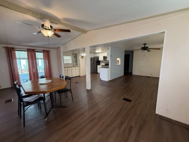 THIS LOVELY, 2/2 MANUFACTURED HOME IS ON LEASED LAND.  MONTHLY on Pine Lakes Country Club in Florida - for sale on GolfHomes.com, golf home, golf lot
