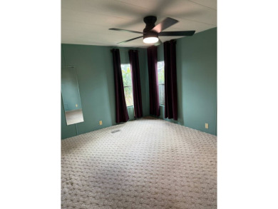 THIS LOVELY, 2/2 MANUFACTURED HOME IS ON LEASED LAND.  MONTHLY on Pine Lakes Country Club in Florida - for sale on GolfHomes.com, golf home, golf lot