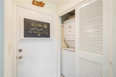 Enjoy relaxed resort-style living in this condo overlooking the on Ocean Village Golf Course in Florida - for sale on GolfHomes.com, golf home, golf lot