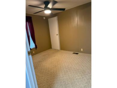 THIS LOVELY, 2/2 MANUFACTURED HOME IS ON LEASED LAND.  MONTHLY on Pine Lakes Country Club in Florida - for sale on GolfHomes.com, golf home, golf lot