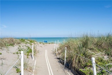 Enjoy relaxed resort-style living in this condo overlooking the on Ocean Village Golf Course in Florida - for sale on GolfHomes.com, golf home, golf lot