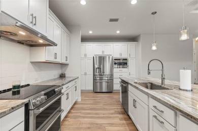 2023-built waterfront masterpiece in the highly sought-after on Saint Andrews South Golf Club in Florida - for sale on GolfHomes.com, golf home, golf lot