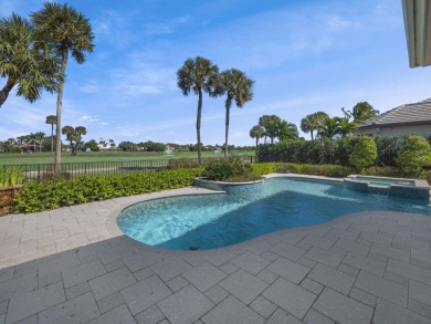 THIS GRACIOUS CUSTOM HOME HAS A GOLF MEMBERSHIP, GOLF AND LAKE on BallenIsles Golf and Country Club in Florida - for sale on GolfHomes.com, golf home, golf lot