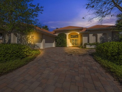 THIS GRACIOUS CUSTOM HOME HAS A GOLF MEMBERSHIP, GOLF AND LAKE on BallenIsles Golf and Country Club in Florida - for sale on GolfHomes.com, golf home, golf lot