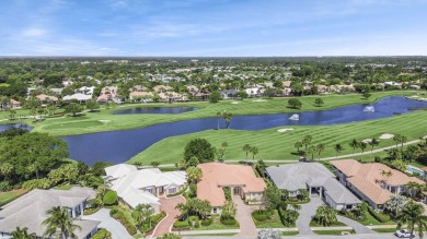 THIS GRACIOUS CUSTOM HOME HAS A GOLF MEMBERSHIP, GOLF AND LAKE on BallenIsles Golf and Country Club in Florida - for sale on GolfHomes.com, golf home, golf lot