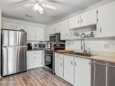 This 3 bedroom 2 bath end corner unit is nestled on the top on Indigo Lakes Golf Club in Florida - for sale on GolfHomes.com, golf home, golf lot