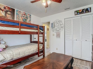 This 3 bedroom 2 bath end corner unit is nestled on the top on Indigo Lakes Golf Club in Florida - for sale on GolfHomes.com, golf home, golf lot