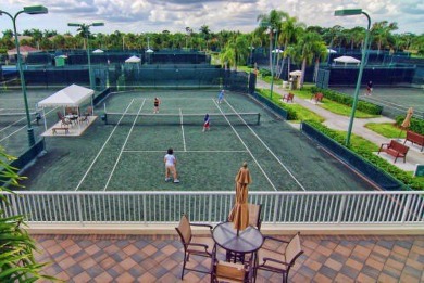 THIS GRACIOUS CUSTOM HOME HAS A GOLF MEMBERSHIP, GOLF AND LAKE on BallenIsles Golf and Country Club in Florida - for sale on GolfHomes.com, golf home, golf lot