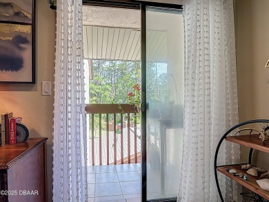 This 3 bedroom 2 bath end corner unit is nestled on the top on Indigo Lakes Golf Club in Florida - for sale on GolfHomes.com, golf home, golf lot