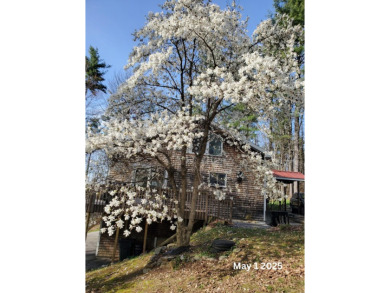 Discover the perfect blend of comfort, privacy, and convenience on Martindale Country Club in Maine - for sale on GolfHomes.com, golf home, golf lot