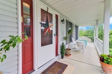Welcome to this beautifully updated home nestled on a serene on Lake Mohawk Golf Club in Ohio - for sale on GolfHomes.com, golf home, golf lot