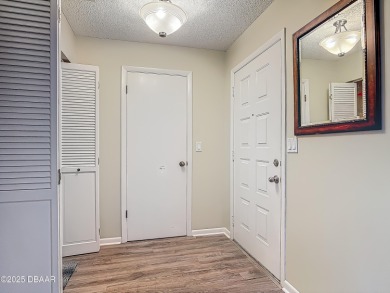 This 3 bedroom 2 bath end corner unit is nestled on the top on Indigo Lakes Golf Club in Florida - for sale on GolfHomes.com, golf home, golf lot