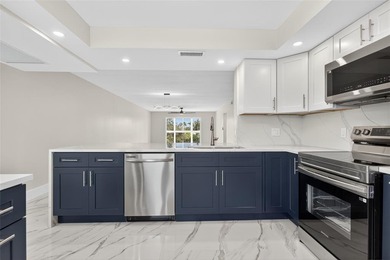 NEWLY RENOVATED EXTRA LARGE CORNER 2BR/2BATH CONDO IN THE SOUGHT on Wynmoor Golf Course in Florida - for sale on GolfHomes.com, golf home, golf lot