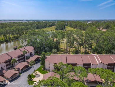 This 3 bedroom 2 bath end corner unit is nestled on the top on Indigo Lakes Golf Club in Florida - for sale on GolfHomes.com, golf home, golf lot