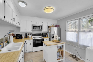 Welcome home to this beautifully updated END-UNIT condo in the on Holly Tree Country Club in South Carolina - for sale on GolfHomes.com, golf home, golf lot