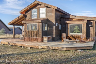 Discover this charming 1-bedroom, 1-bathroom cabin in the scenic on Teton Springs Resort and Club in Idaho - for sale on GolfHomes.com, golf home, golf lot