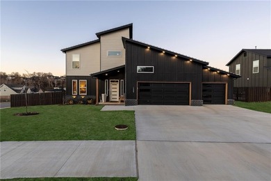 Modern design meets luxury living in this impressive 4-bedroom on Big Sugar Golf Club in Arkansas - for sale on GolfHomes.com, golf home, golf lot