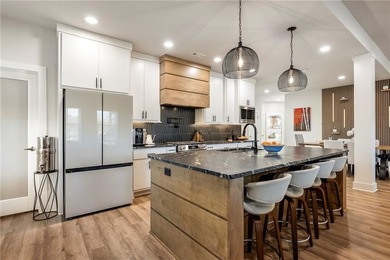 Modern design meets luxury living in this impressive 4-bedroom on Big Sugar Golf Club in Arkansas - for sale on GolfHomes.com, golf home, golf lot