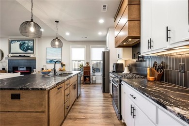 Modern design meets luxury living in this impressive 4-bedroom on Big Sugar Golf Club in Arkansas - for sale on GolfHomes.com, golf home, golf lot