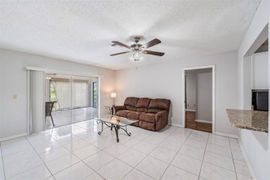 Short Sale. Spacious 2-bedroom, 2-bath, 2-car garage home in Sun on Caloosa Greens Executive Golf Course in Florida - for sale on GolfHomes.com, golf home, golf lot