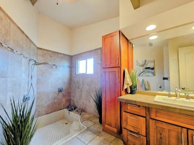 Hidden from the road by mature landscaping (terraced lava rock on Waikoloa Village Golf Club in Hawaii - for sale on GolfHomes.com, golf home, golf lot
