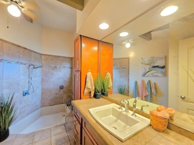 Hidden from the road by mature landscaping (terraced lava rock on Waikoloa Village Golf Club in Hawaii - for sale on GolfHomes.com, golf home, golf lot