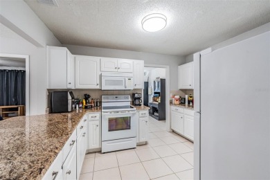 Short Sale. Spacious 2-bedroom, 2-bath, 2-car garage home in Sun on Caloosa Greens Executive Golf Course in Florida - for sale on GolfHomes.com, golf home, golf lot