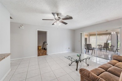 Short Sale. Spacious 2-bedroom, 2-bath, 2-car garage home in Sun on Caloosa Greens Executive Golf Course in Florida - for sale on GolfHomes.com, golf home, golf lot
