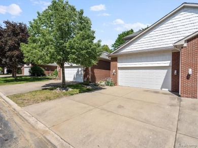 Discover elegant living in this Waterford Fairways condo on White Lake Oaks Golf Course in Michigan - for sale on GolfHomes.com, golf home, golf lot