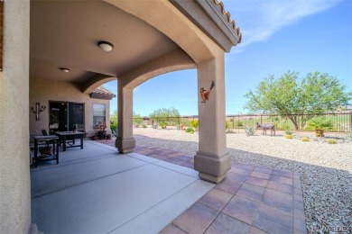 Imagine stepping into a charming 3-bedroom, 2-bathroom home on Laughlin Ranch Golf Club in Arizona - for sale on GolfHomes.com, golf home, golf lot