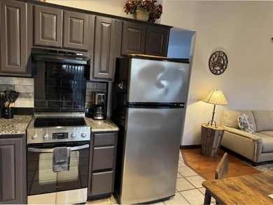 Wake up to lake views and easy living on Table Rock Lake. This on Holiday Island Executive Golf Course in Arkansas - for sale on GolfHomes.com, golf home, golf lot