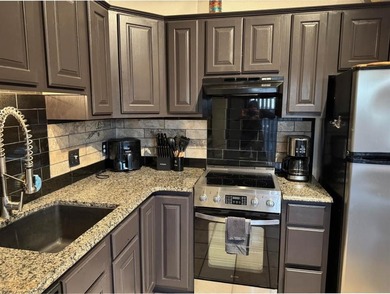 Wake up to lake views and easy living on Table Rock Lake. This on Holiday Island Executive Golf Course in Arkansas - for sale on GolfHomes.com, golf home, golf lot