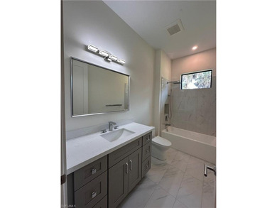 NEW CONSTRUCTION | GOLDEN GATE ESTATES | NAPLES Discover this on The Club At Twin Eagles in Florida - for sale on GolfHomes.com, golf home, golf lot