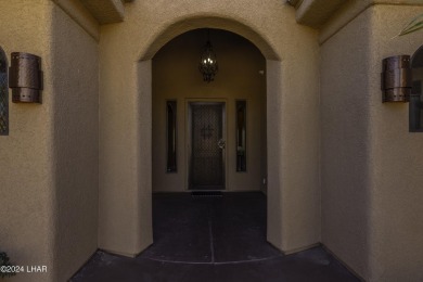 This home is located at the end of a private cul-de-sac in the on London Bridge Golf Course in Arizona - for sale on GolfHomes.com, golf home, golf lot