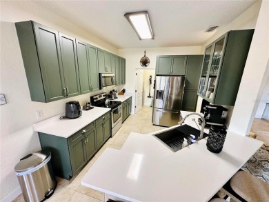 Stunning and completely remodeled fully furnished 4-bedroom on Highlands Reserve Golf Club in Florida - for sale on GolfHomes.com, golf home, golf lot