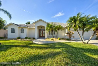 This exquisite waterfront home w/ gas heated; saltwater pool on Savannahs Golf Club in Florida - for sale on GolfHomes.com, golf home, golf lot