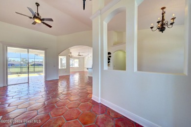 This exquisite waterfront home w/ gas heated; saltwater pool on Savannahs Golf Club in Florida - for sale on GolfHomes.com, golf home, golf lot