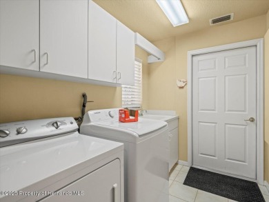 Location, location, location! This 1996 Lindhorst built Custom on Glen Lakes Country Club in Florida - for sale on GolfHomes.com, golf home, golf lot