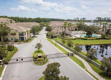 The POND view of this ground-floor condo will WOW you! Only two on The Palencia Club in Florida - for sale on GolfHomes.com, golf home, golf lot