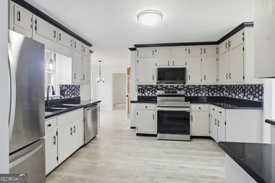 Welcome home to 560 Clubhouse Drive, ideally situated on a quiet on Honey Creek Country Club in Georgia - for sale on GolfHomes.com, golf home, golf lot